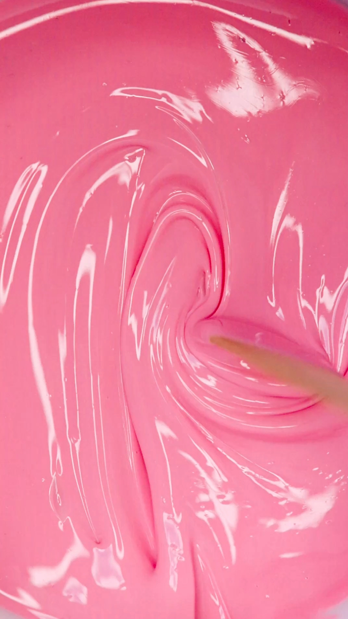 Glossy pink Plumeria hard wax, the rosin-free professional formula